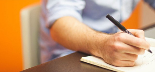 Writing in notebook